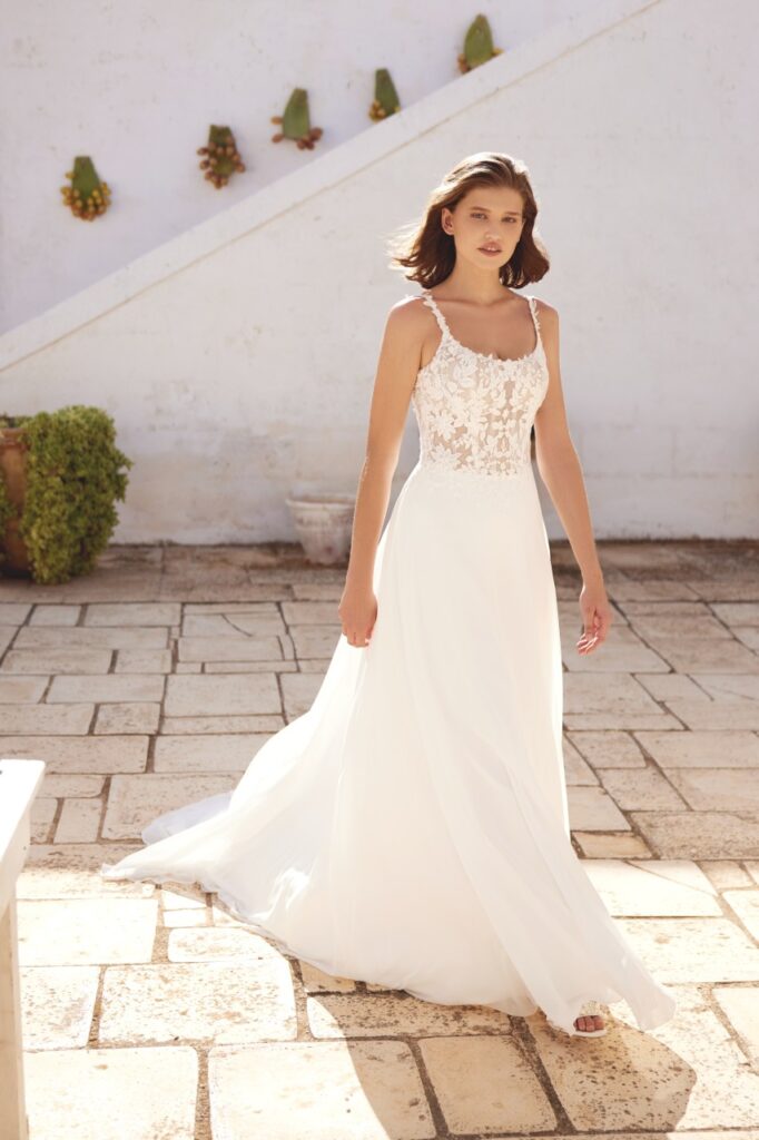66391-Lillian West-Pure Bridal. A-line gown with scoop neckline. Sheer bodice detailed with exposed boning and matte lace appliques trickling down to lightweight chiffon skirt. Edmonton wedding shop, Edmonton bridal shop, Edmonton wedding dress.