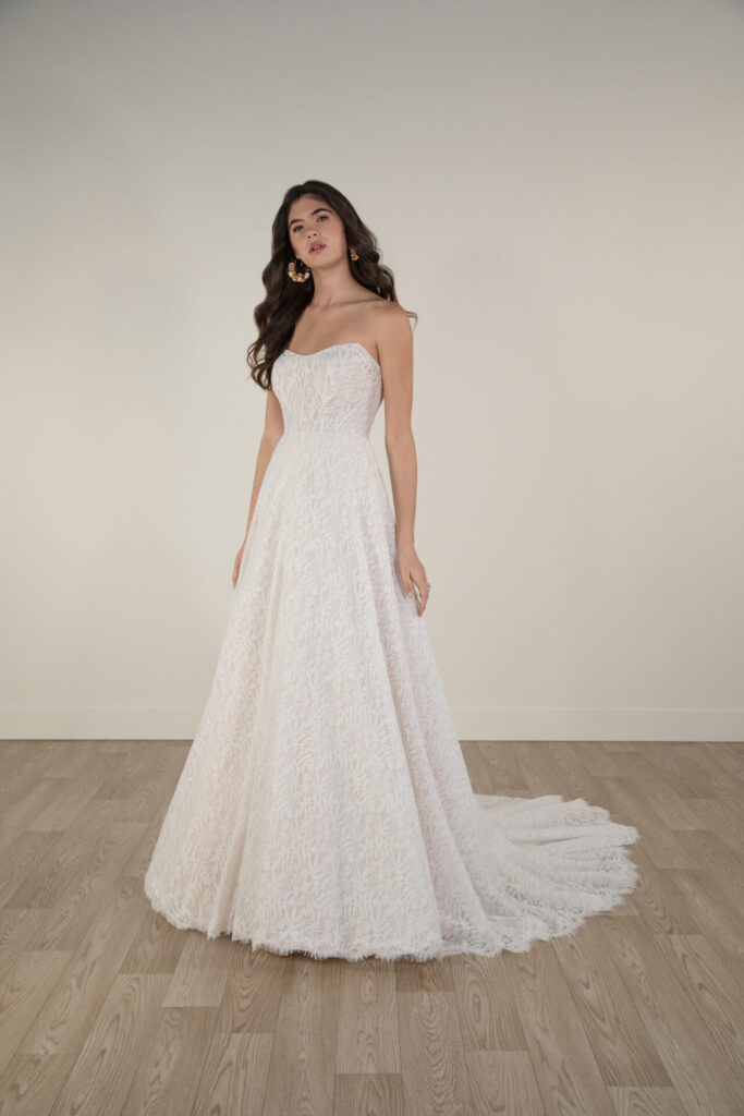 7971-Stella York-Pure Bridal,  7971 Modern Romantic Strapless Lace A-Line Wedding Dress  by Stella York 7971 Modern Romantic Strapless Lace A-Line Wedding Dress  by Stella York 7971 Modern Romantic Strapless Lace A-Line Wedding Dress  by Stella York 7971 Modern Romantic Strapless Lace A-Line Wedding Dress  by Stella York 7971 Modern Romantic Strapless Lace A-Line Wedding Dress  by Stella York 7971 Modern Romantic Strapless Lace A-Line Wedding Dress  by Stella York 7971 Modern Romantic Strapless Lace A-Line Wedding Dress  by Stella York 7971 Modern Romantic Strapless Lace A-Line Wedding Dress  by Stella York 7971 Modern Romantic Strapless Lace A-Line Wedding Dress  by Stella York 7971 Modern Romantic Strapless Lace A-Line Wedding Dress  by Stella York 7971   MODERN ROMANTIC STRAPLESS LACE A-LINE WEDDING DRESS Adorned in a modern vintage lace, Style 7971 is a captivating strapless A-line wedding dress made for the modern romantic bride. A subtle scoop neckline shapes the fitted strapless bodice and meets a gown-length row of lace-covered buttons down the back. The dreamy allover lace look features a classic A-line silhouette that gently glides out from the waist into a full A-line skirt that drapes effortlessly into a romantic sweeping train with a delicate raw-edged lace hem. Simple and romantic, this modern A-line wedding gown exudes a timeless elegance for the modern bride. This wedding gown is also available in plus sizes, Edmonton wedding shop, Edmonton wedding dress