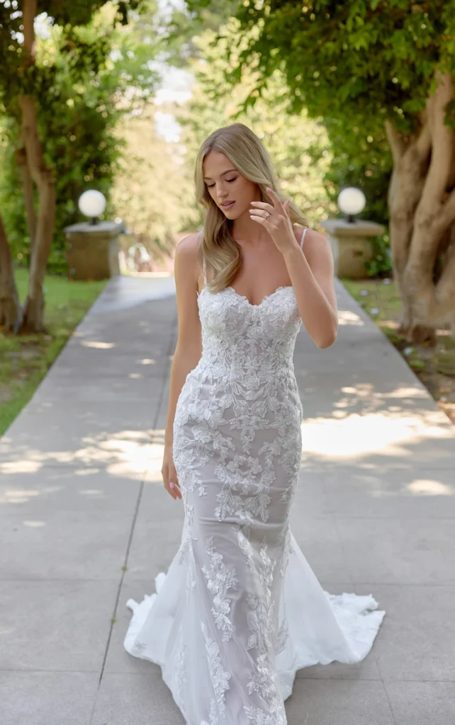 Essense of Australia Style D4344 organic floral lace fit-and-flare wedding dress with beaded spaghetti straps and an exposed corset bodice and dramatic lace train at Pure Bridal in Edmonton.