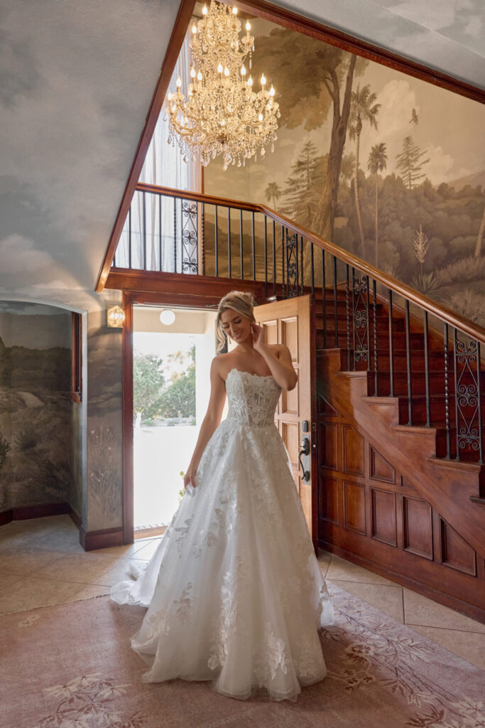 Essense of Australia Style D4403 strapless leafy lace ballgown wedding dress with a slight scoop neckline, exposed corset boning, and sequined tulle skirt, bodice available lined or unlined at Pure Bridal in Edmonton.