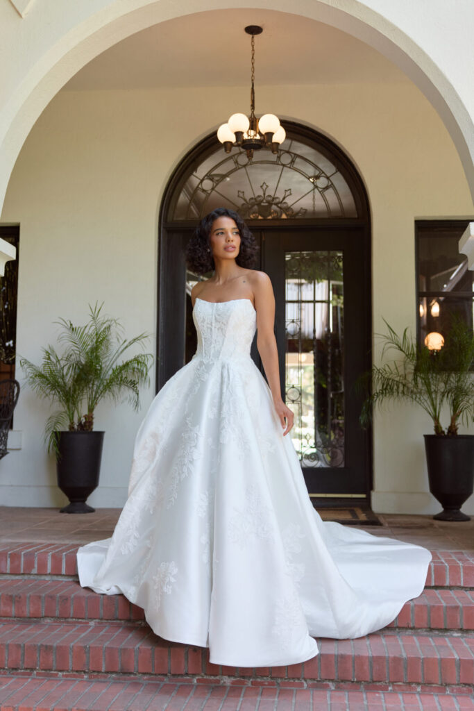 Essense of Australia Style D4407 strapless Mikado A-line wedding dress with a slight scoop neckline and boned corset bodice, also available in plus size or all Mikado with no lace at Pure Bridal in Edmonton.