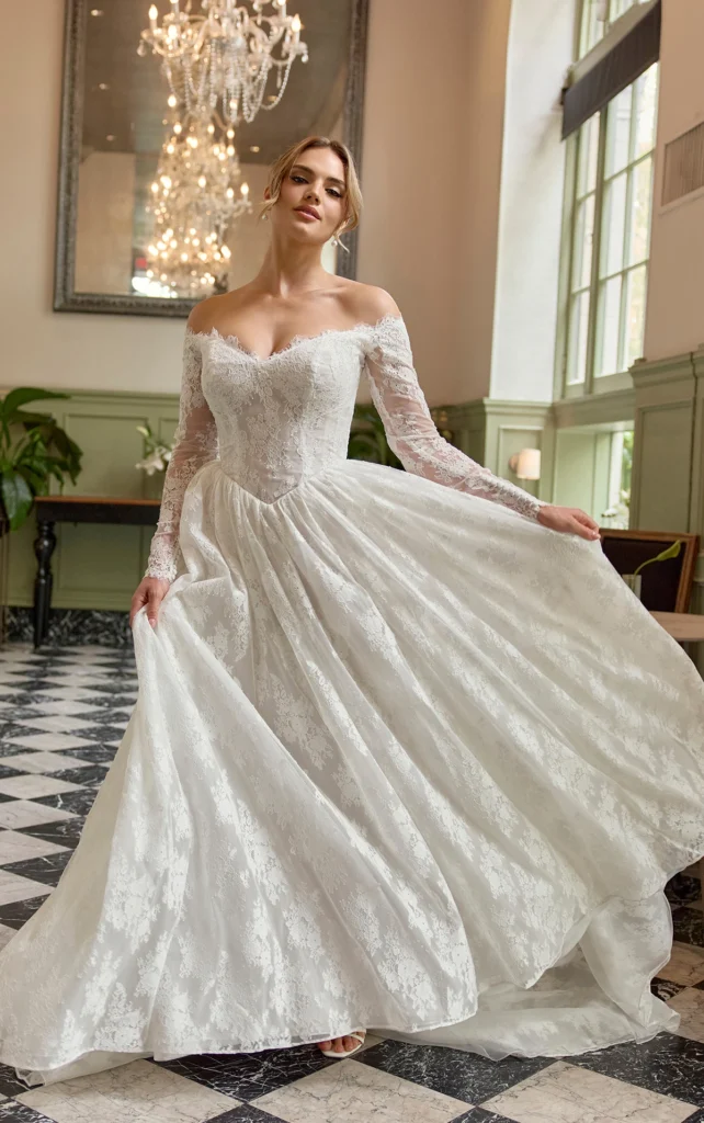 Essense of Australia Style D4466 all over classic lace ballgown wedding dress with a basque waist and long sleeves, also available strapless at Pure Bridal in Edmonton.
