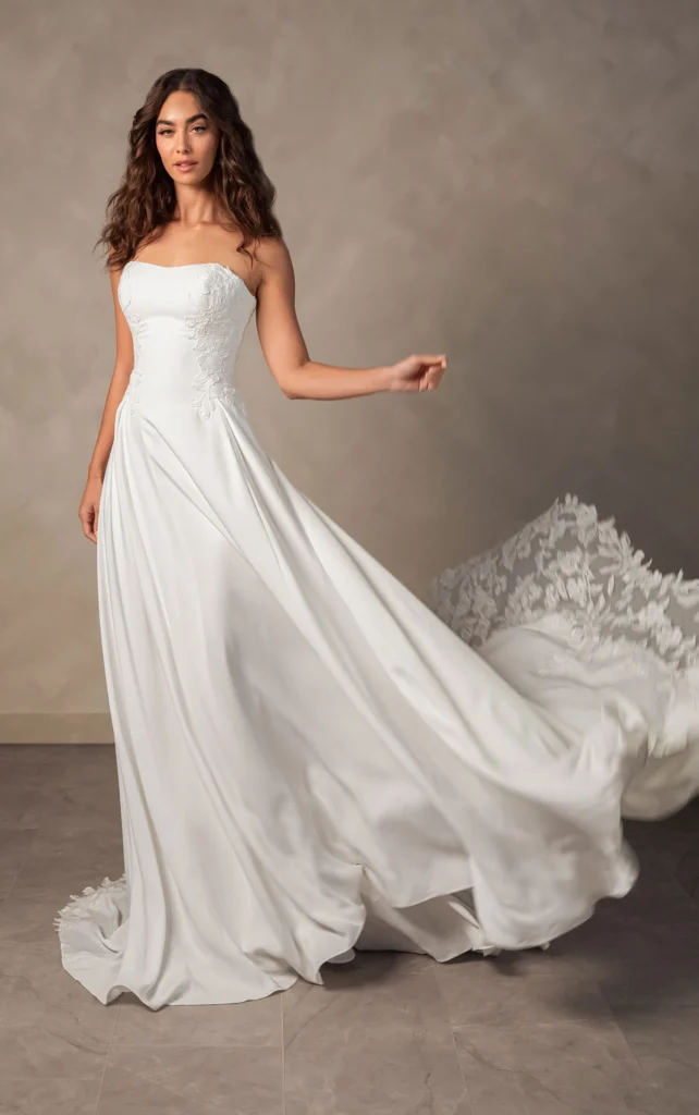 Essense of Australia Style D4504 liquid crepe A-line wedding dress with a strapless straight sweetheart bodice, floral lace appliqu&eacute;s, and a scalloped train at Pure Bridal in Edmonton