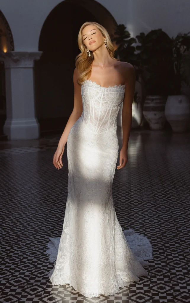 Essense of Australia Style D4541 lace fit-and-flare wedding dress with a strapless sweetheart corset bodice, exposed boning, and scalloped train at Pure Bridal in Edmonton